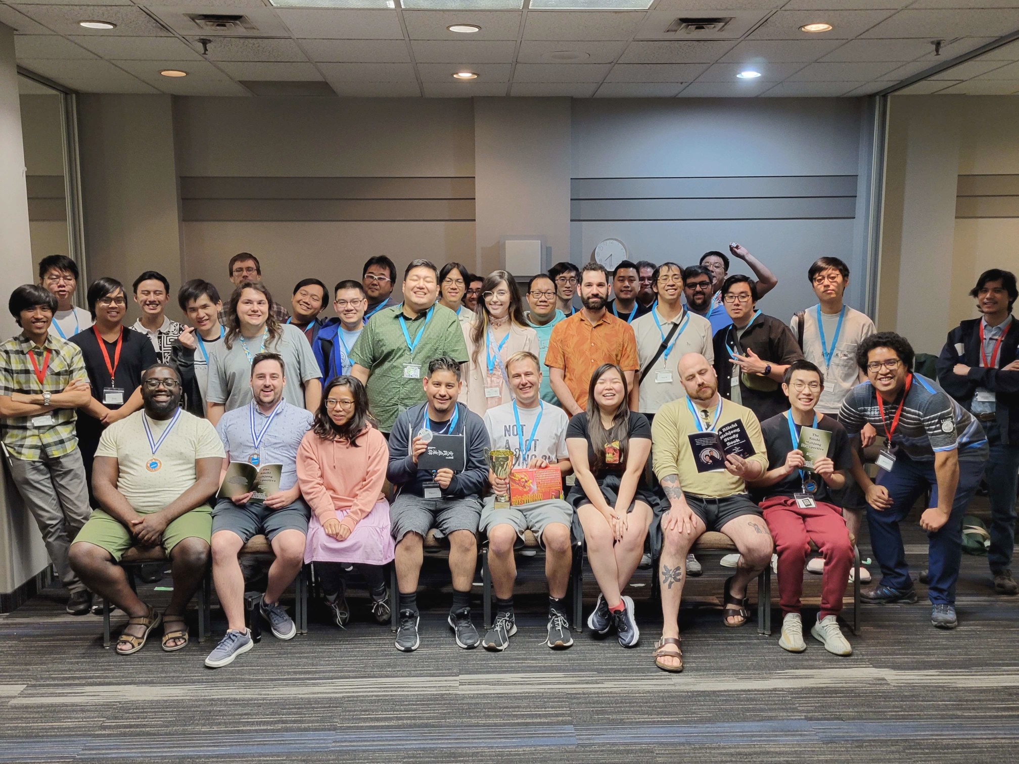 Group photo with the participants, staff and substitutes of the Toronto Riichi Open 2023. Prize winners show off their awards.